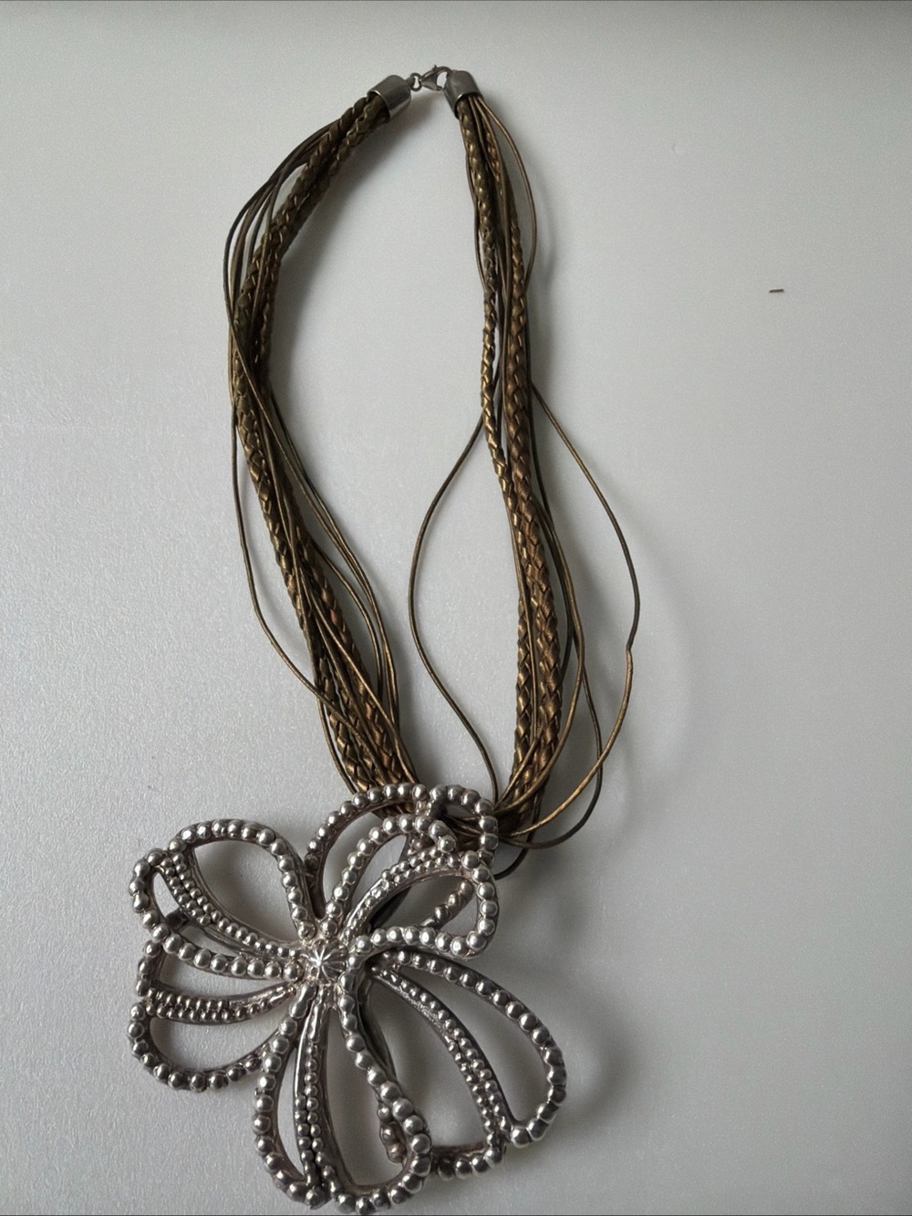 Brown Multi-Strand Necklace with Silver Floral Pendant